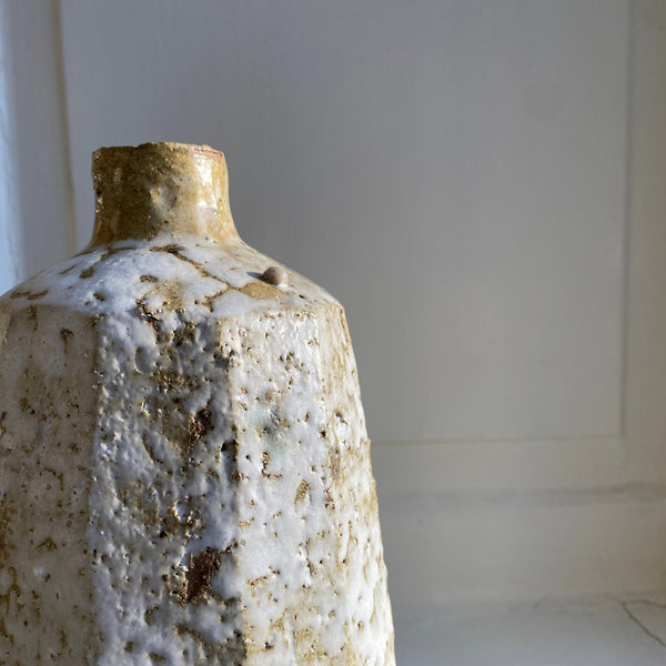 Faceted stoneware vase