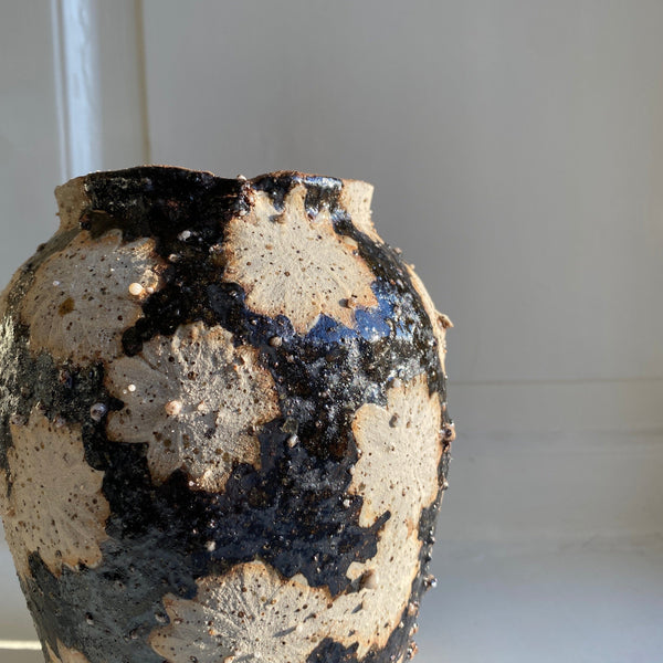 Black and flower decor stoneware vase