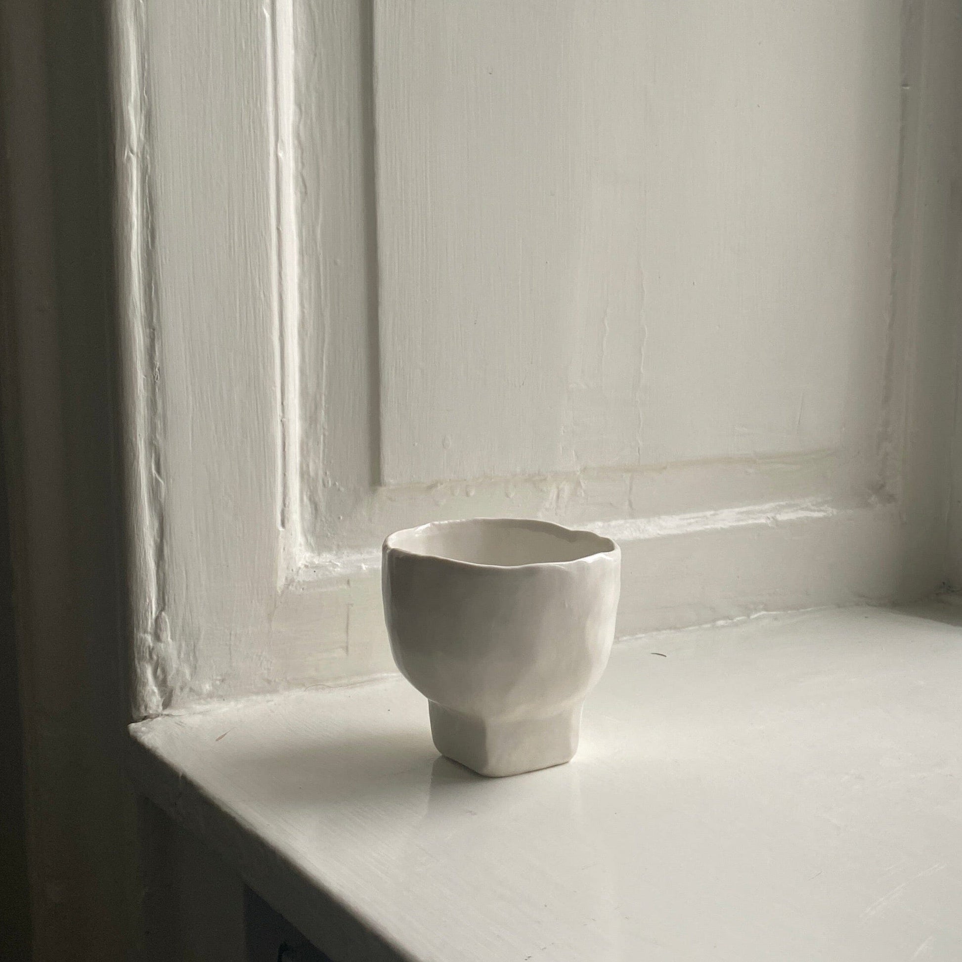 Square-based tea cup cup Joe Christopherson 